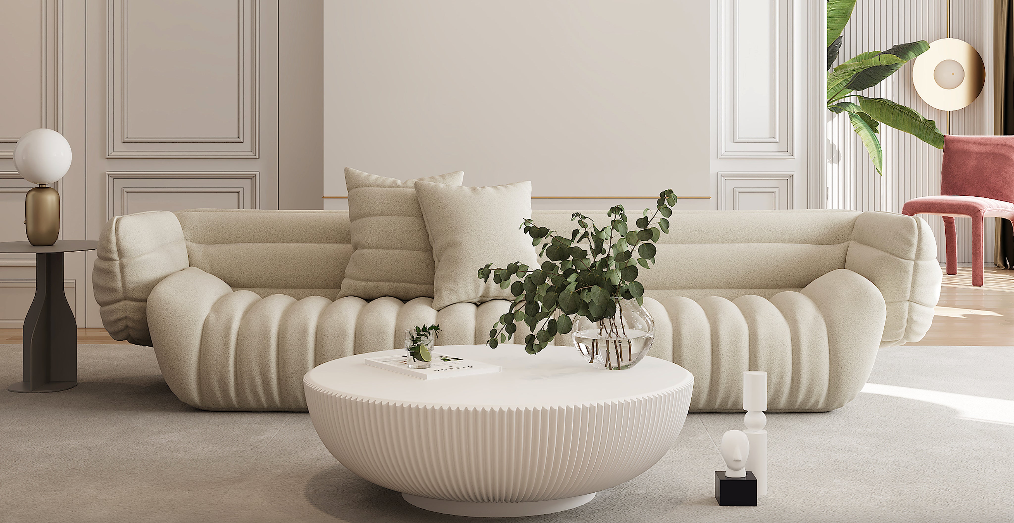 Modern living room with a beige sofa, round coffee table, and decorative elements.